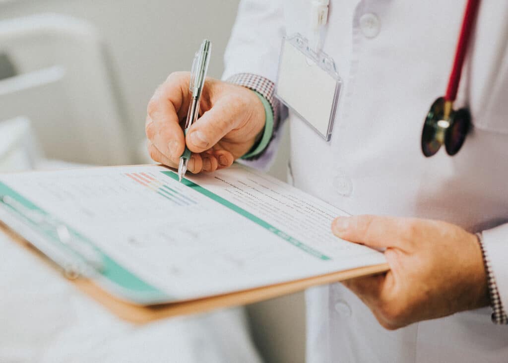 A doctor fills in a prescription off-label for a patient.